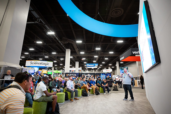 A presentation at a booth in the World of Solutions